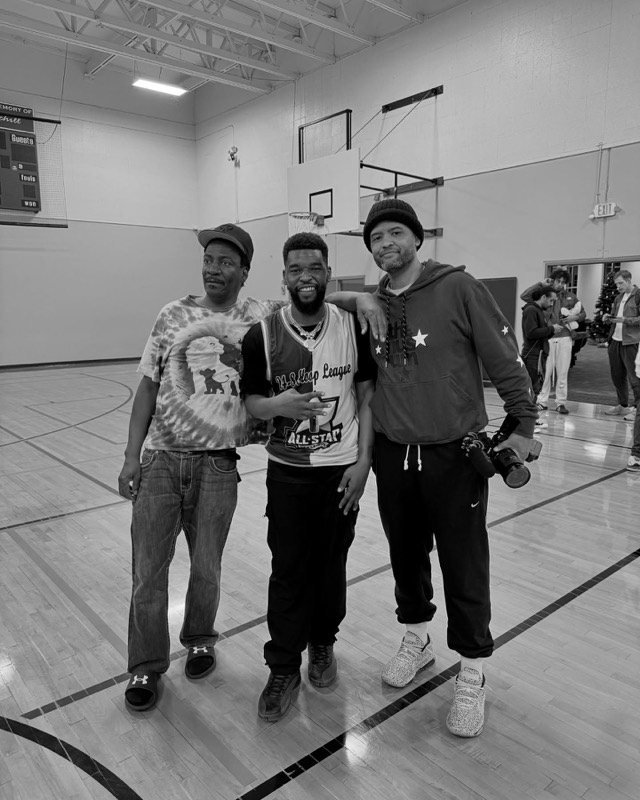 Hosts and guests together on a basketball court